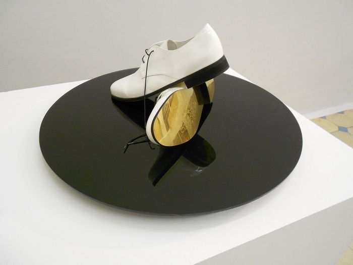 8. Radu Cioca - _Golden shoes for golden routes_ (installation)